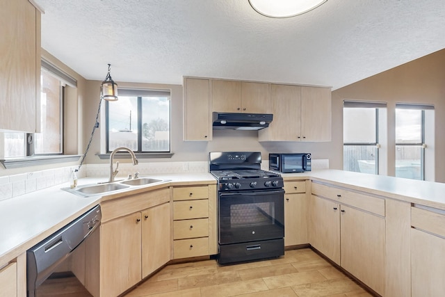 kitchen featuring light brown cabinets, under cabinet range hood, a sink, light countertops, and black appliances