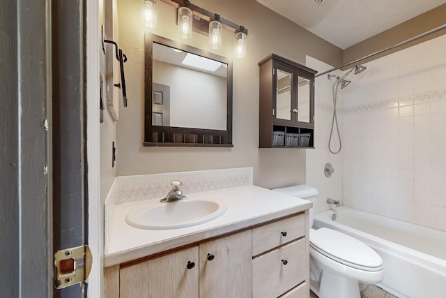 full bath featuring toilet, shower / bathtub combination, and vanity