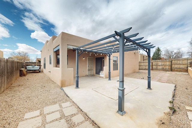 view of patio with a fenced backyard and a pergola