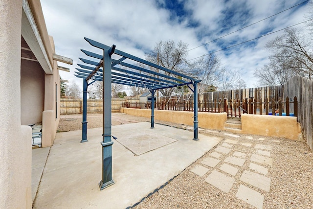 view of patio / terrace with a fenced backyard and a pergola