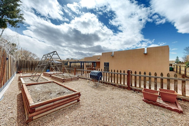 view of yard with a fenced backyard and a vegetable garden