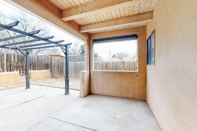 view of patio with fence and a pergola