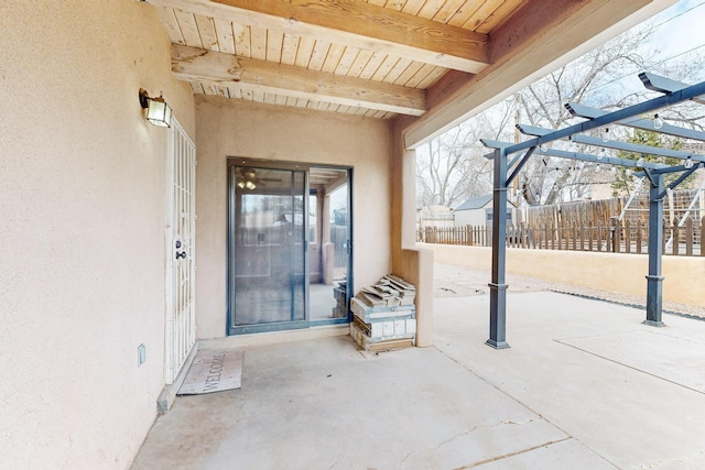 view of patio / terrace featuring fence