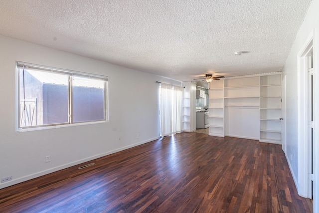 unfurnished living room with ceiling fan, dark wood-type flooring, a textured ceiling, and visible vents