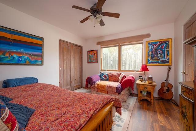 bedroom featuring a closet, a ceiling fan, and wood finished floors