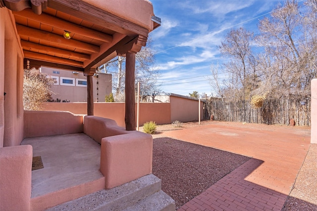 view of yard featuring a patio and fence