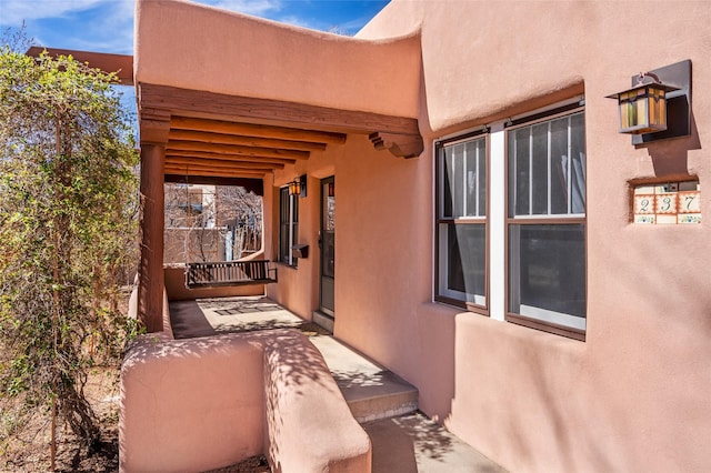 view of side of property with stucco siding