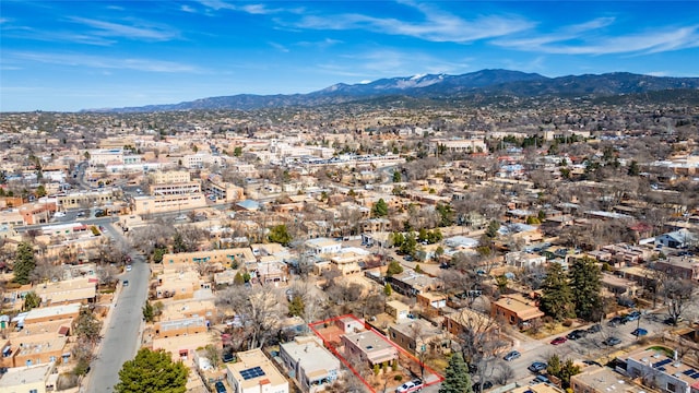 birds eye view of property featuring a mountain view