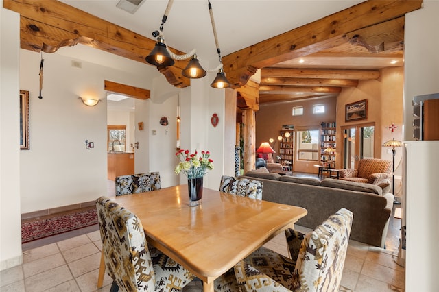 dining room featuring beam ceiling, visible vents, baseboards, and light tile patterned floors