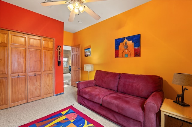 carpeted living room with a ceiling fan