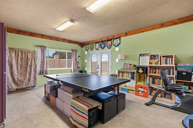 game room featuring a textured ceiling