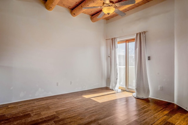 unfurnished room with beamed ceiling, wood ceiling, a ceiling fan, and wood finished floors