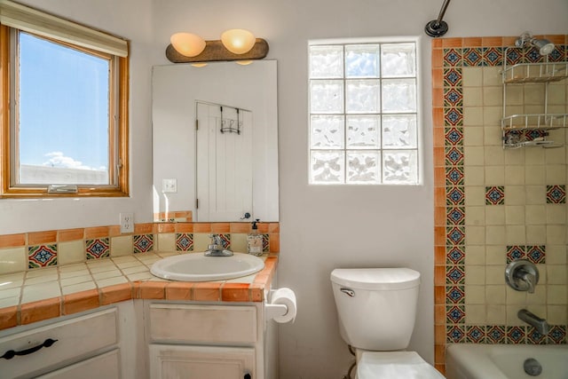full bath with toilet, shower / washtub combination, and vanity
