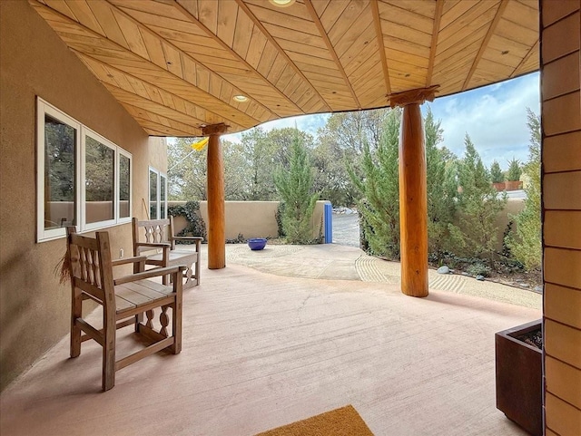 view of patio featuring fence