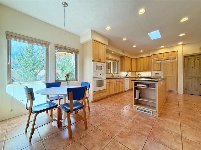 kitchen featuring open shelves, dark countertops, recessed lighting, light tile patterned floors, and built in appliances