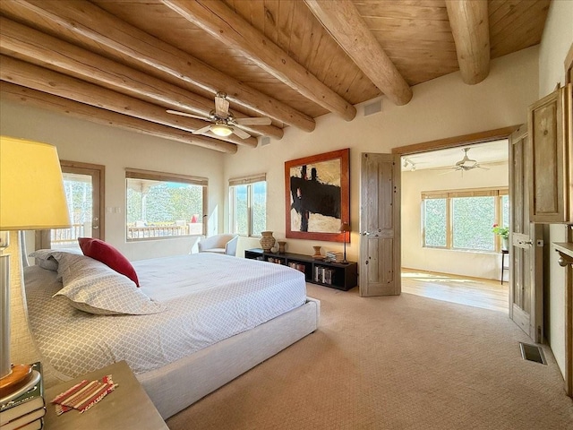 bedroom featuring visible vents, beamed ceiling, and wooden ceiling