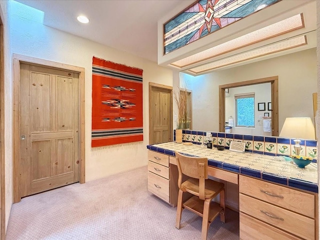 bathroom featuring recessed lighting and vanity