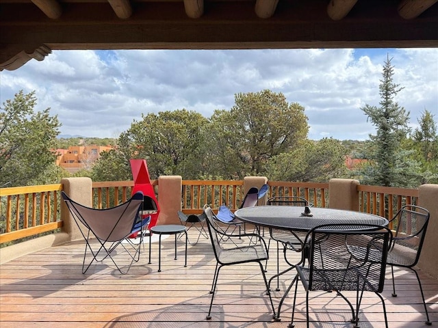 wooden deck featuring outdoor dining space