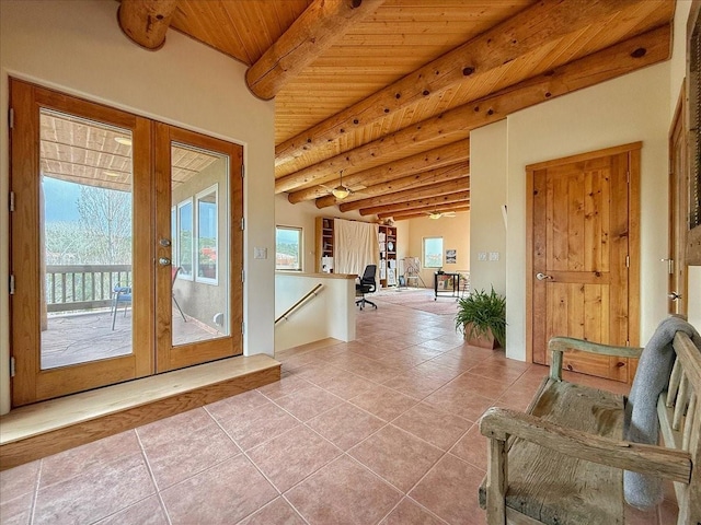 entryway with tile patterned flooring, wooden ceiling, beamed ceiling, and french doors