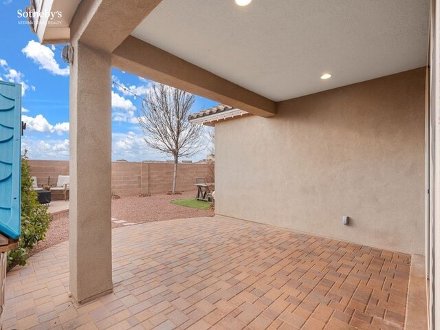 view of patio / terrace featuring fence