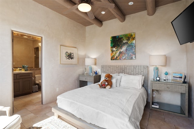 bedroom featuring connected bathroom, beamed ceiling, wooden ceiling, and recessed lighting