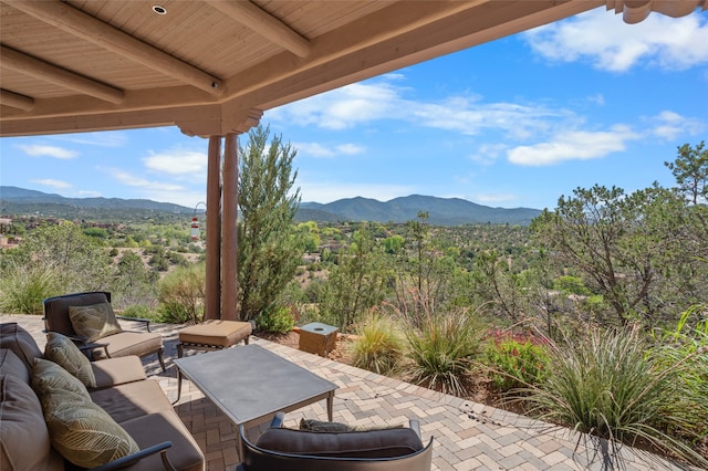 view of patio featuring a mountain view and an outdoor hangout area