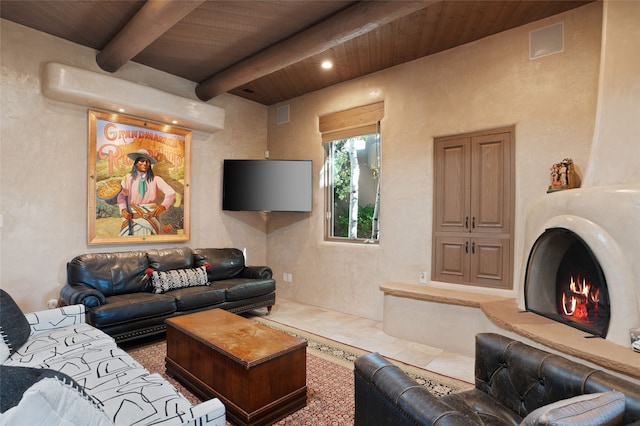 living room with wooden ceiling, beamed ceiling, a fireplace, and visible vents