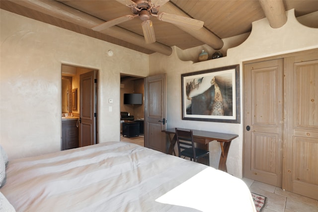 bedroom with beamed ceiling, light tile patterned floors, and wood ceiling