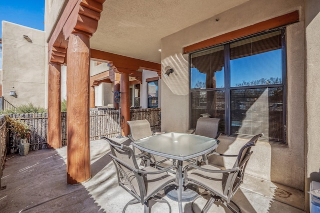 view of patio / terrace with outdoor dining space and fence