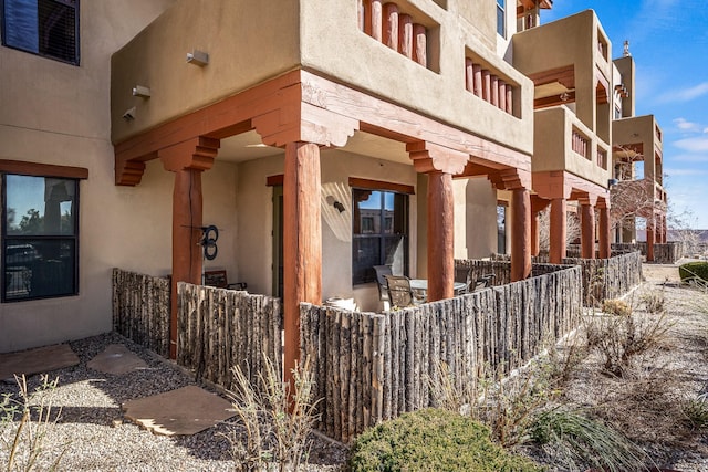 view of side of home with stucco siding