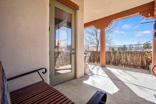 view of patio / terrace featuring fence