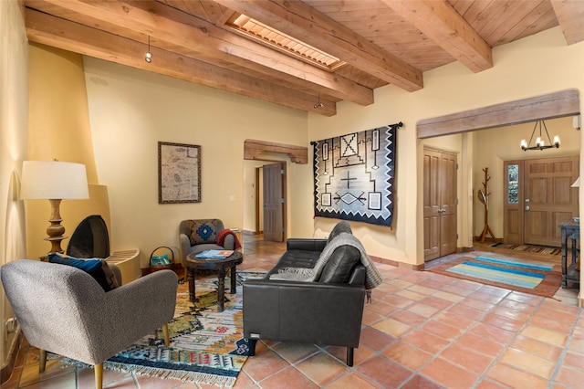 living room with tile patterned flooring, beamed ceiling, wooden ceiling, and an inviting chandelier