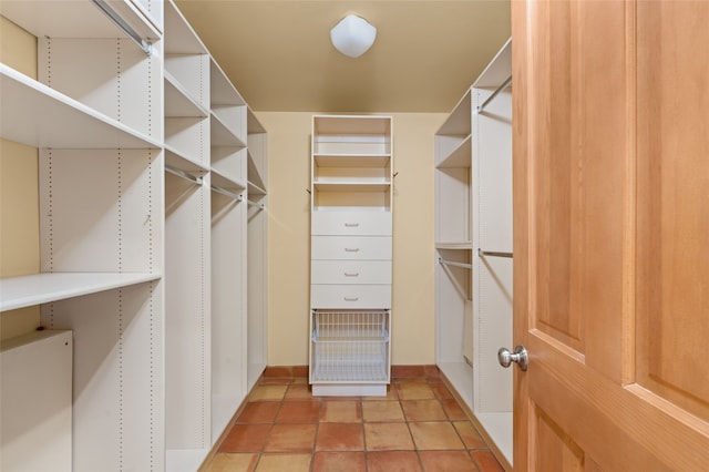 walk in closet featuring light tile patterned flooring