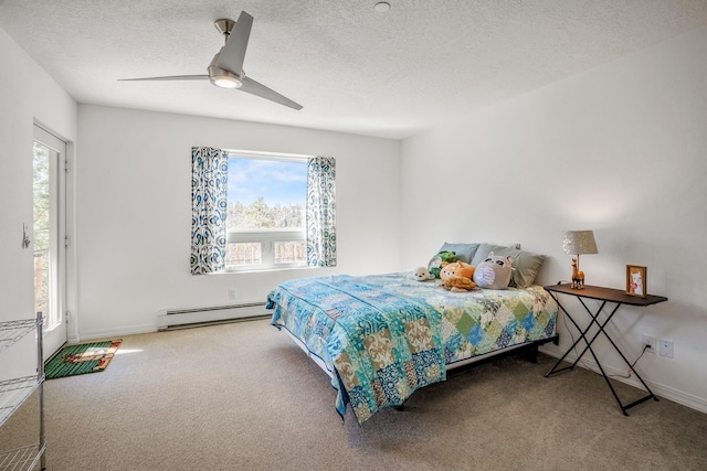 bedroom featuring a ceiling fan, a textured ceiling, carpet, a baseboard radiator, and baseboards