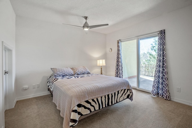 bedroom featuring carpet flooring, a textured ceiling, baseboards, and access to outside