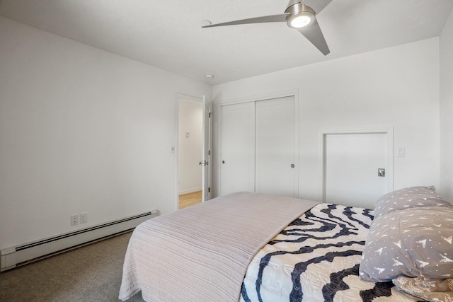 bedroom featuring carpet, a closet, baseboard heating, and ceiling fan