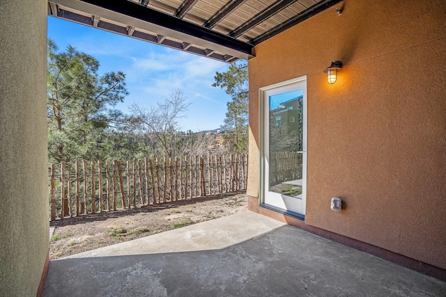 view of patio featuring fence