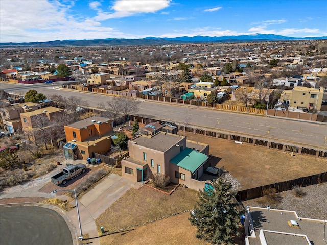 birds eye view of property with a residential view and a mountain view