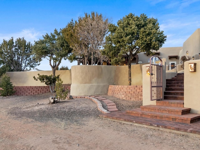 view of gate featuring a fenced front yard