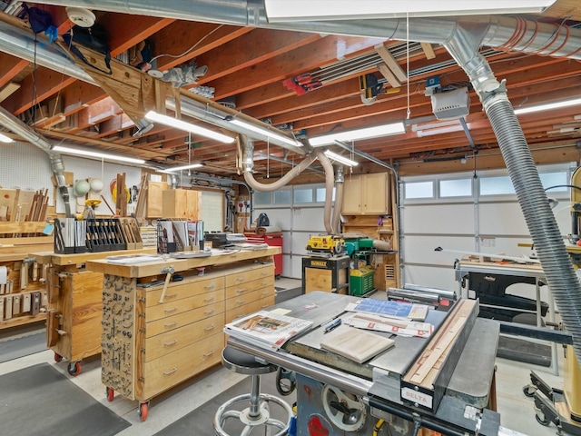 garage featuring a workshop area and a garage door opener