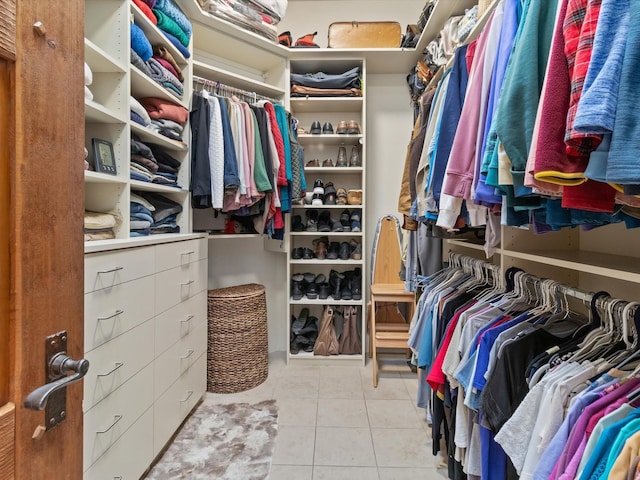 walk in closet with tile patterned floors