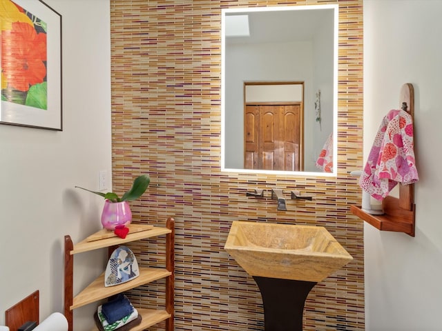 bathroom with tile walls