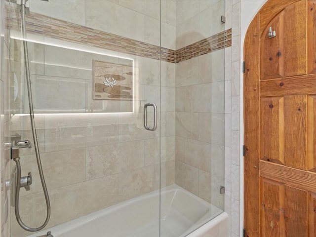 full bathroom featuring combined bath / shower with glass door