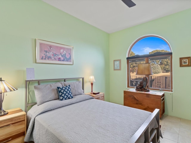 bedroom featuring tile patterned floors and a ceiling fan