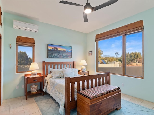 tiled bedroom featuring ceiling fan and a wall unit AC