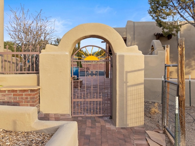 view of gate with fence