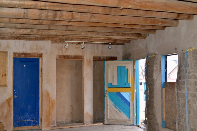 miscellaneous room featuring beamed ceiling