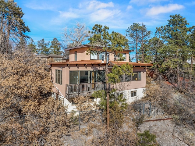 view of front of property featuring a fenced front yard and stucco siding