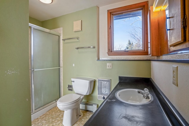 full bath with a shower stall, toilet, vanity, and a baseboard radiator