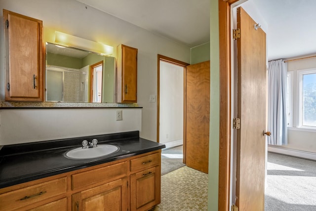 bathroom featuring vanity and a baseboard radiator